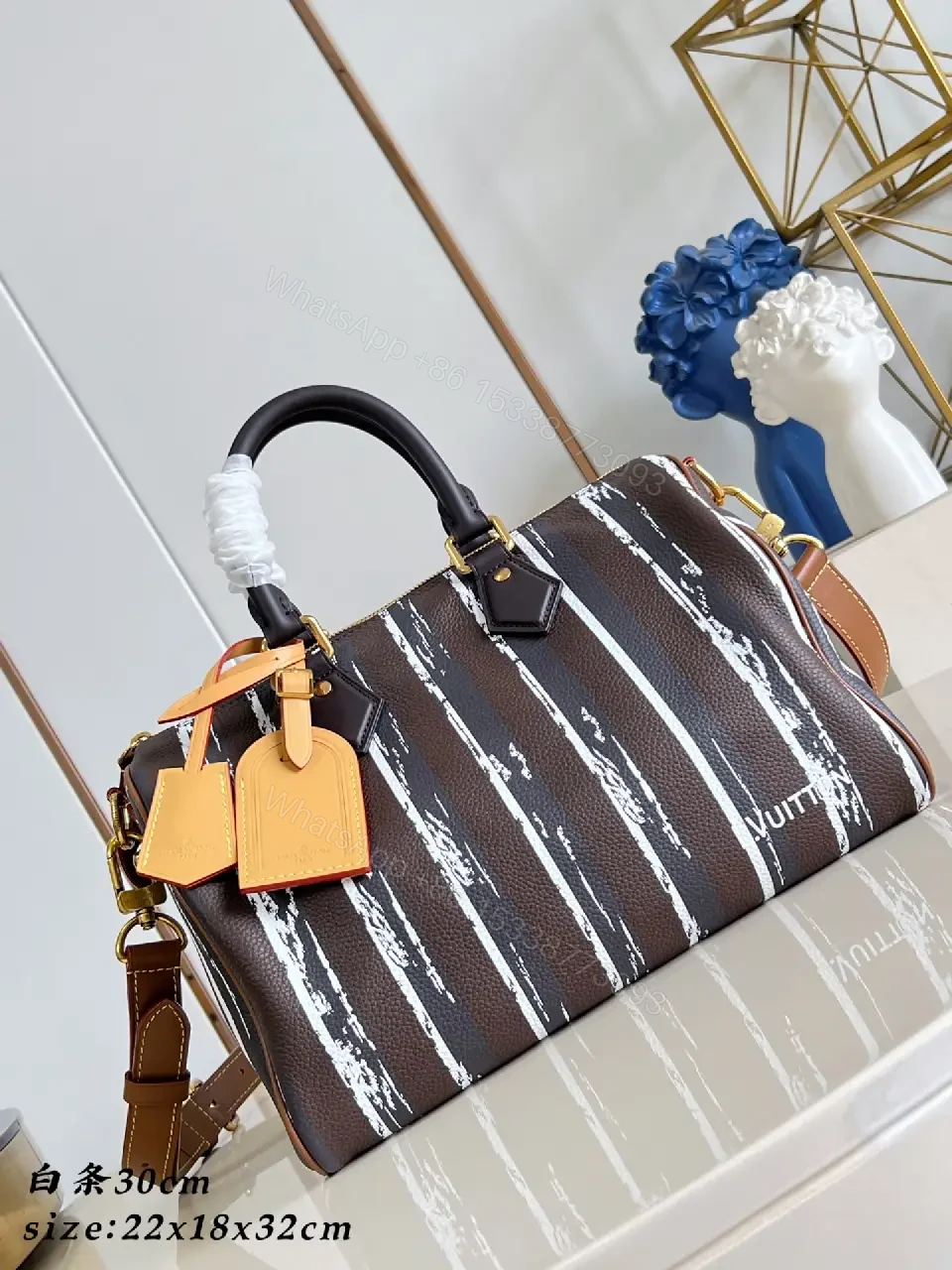 View 6 of Brown leather handbag with striped monogram pattern for luxury everyday use