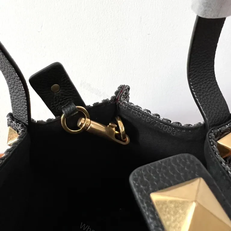 View 4 of Black Woven Luxe Handbag: Compact, Gold-Accent Style Bag