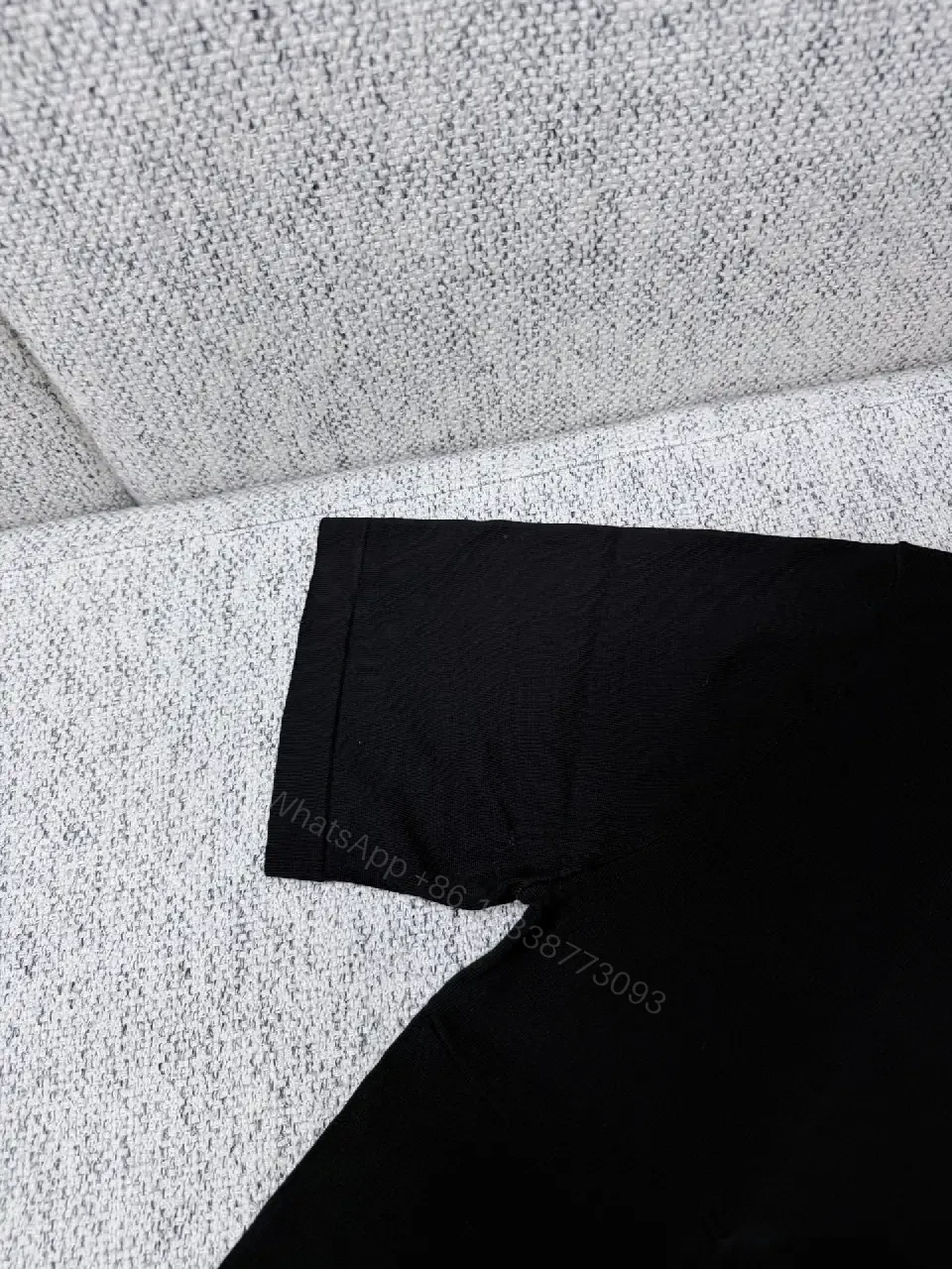 View 7 of Black Polo with Subtle Gold Logo - Refined Everyday Versatility