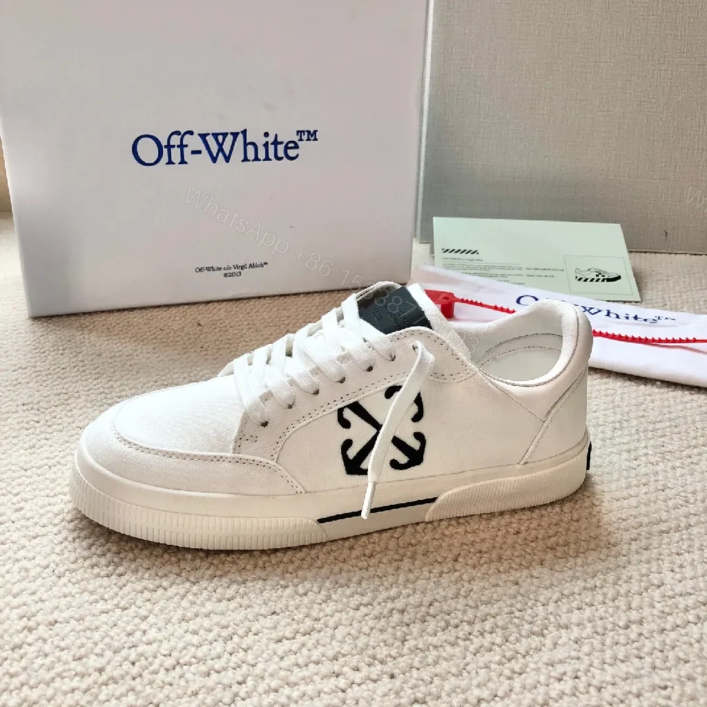 View 3 of Minimalist White Leather Low-Top Sneakers with Signature Detail
