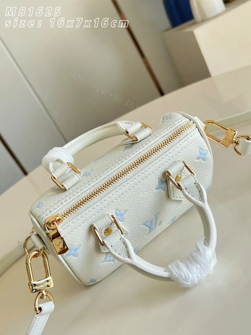 View 4 of Soft White Mini Satchel – Textured Leather, Light Blue Accents, Luxury Everyday Carry
