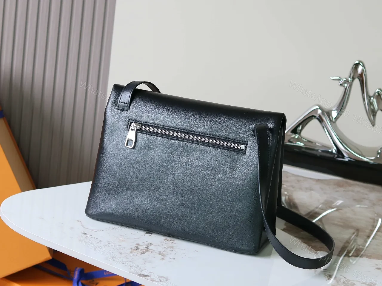 View 6 of Structured Minimalist Clutch: Luxe Faux Leather, Embossed Logo, Magnetic Closure