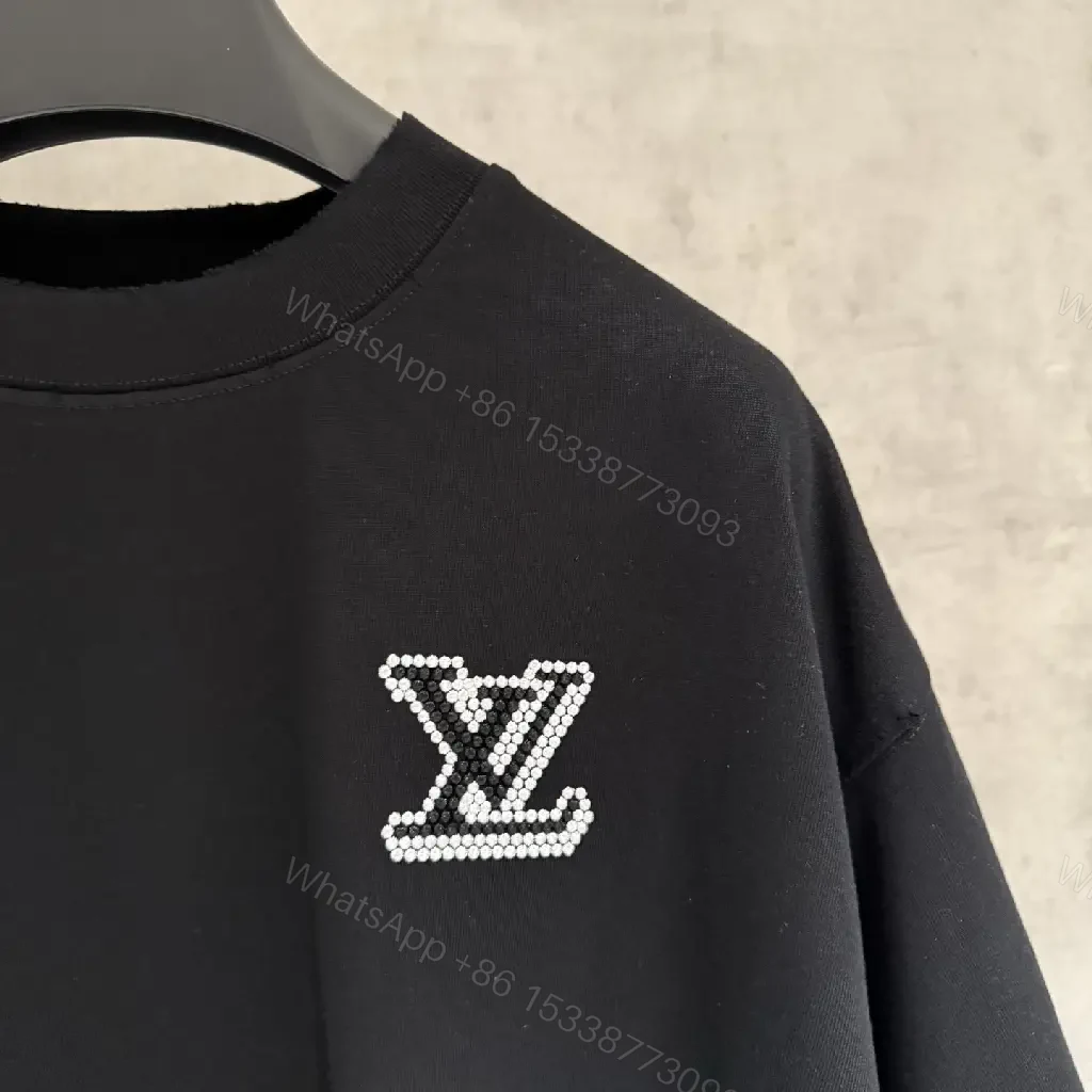 View 7 of Oversized Black Knit Tee, Luxury Crest Embroidery, Casual Comfort