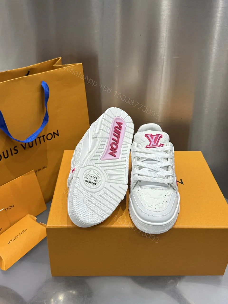 View 2 of White Leather Low-Top Trainer with Pink Embroidery Detail