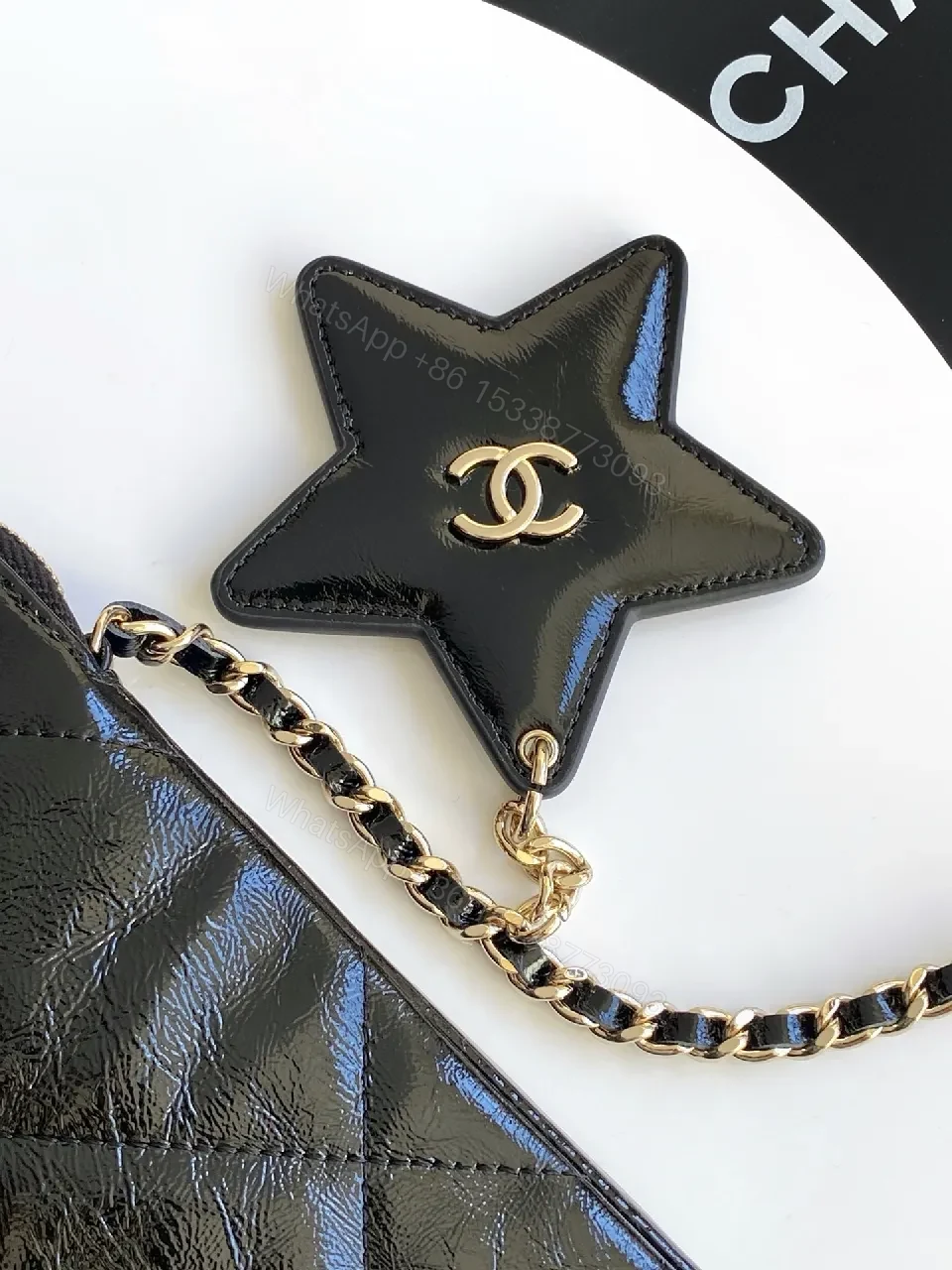 View 4 of Black Quilted Crossbody Bag with Gold Chain