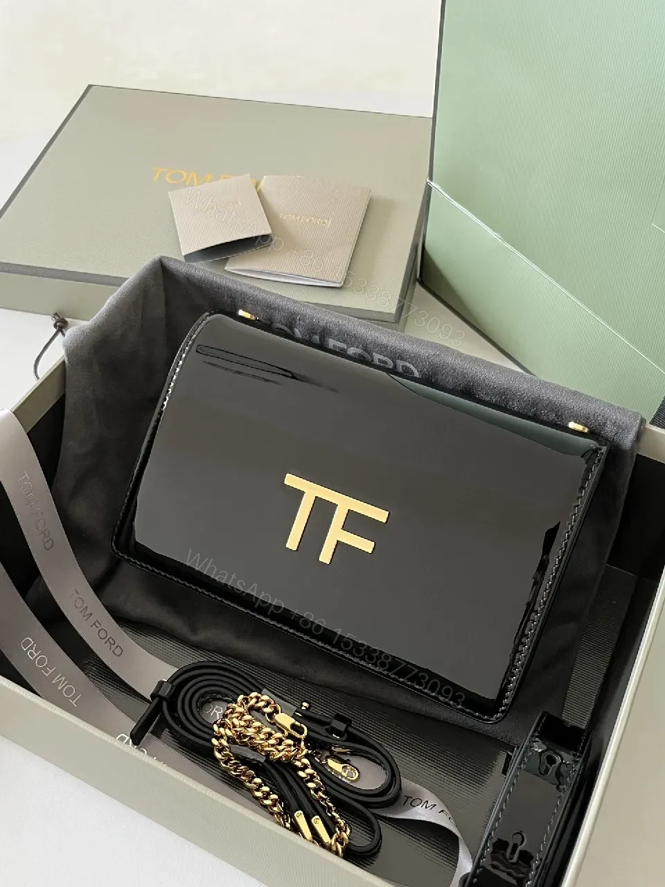 View 8 of Compact Black Leather Crossbody with Gold TF Emblem