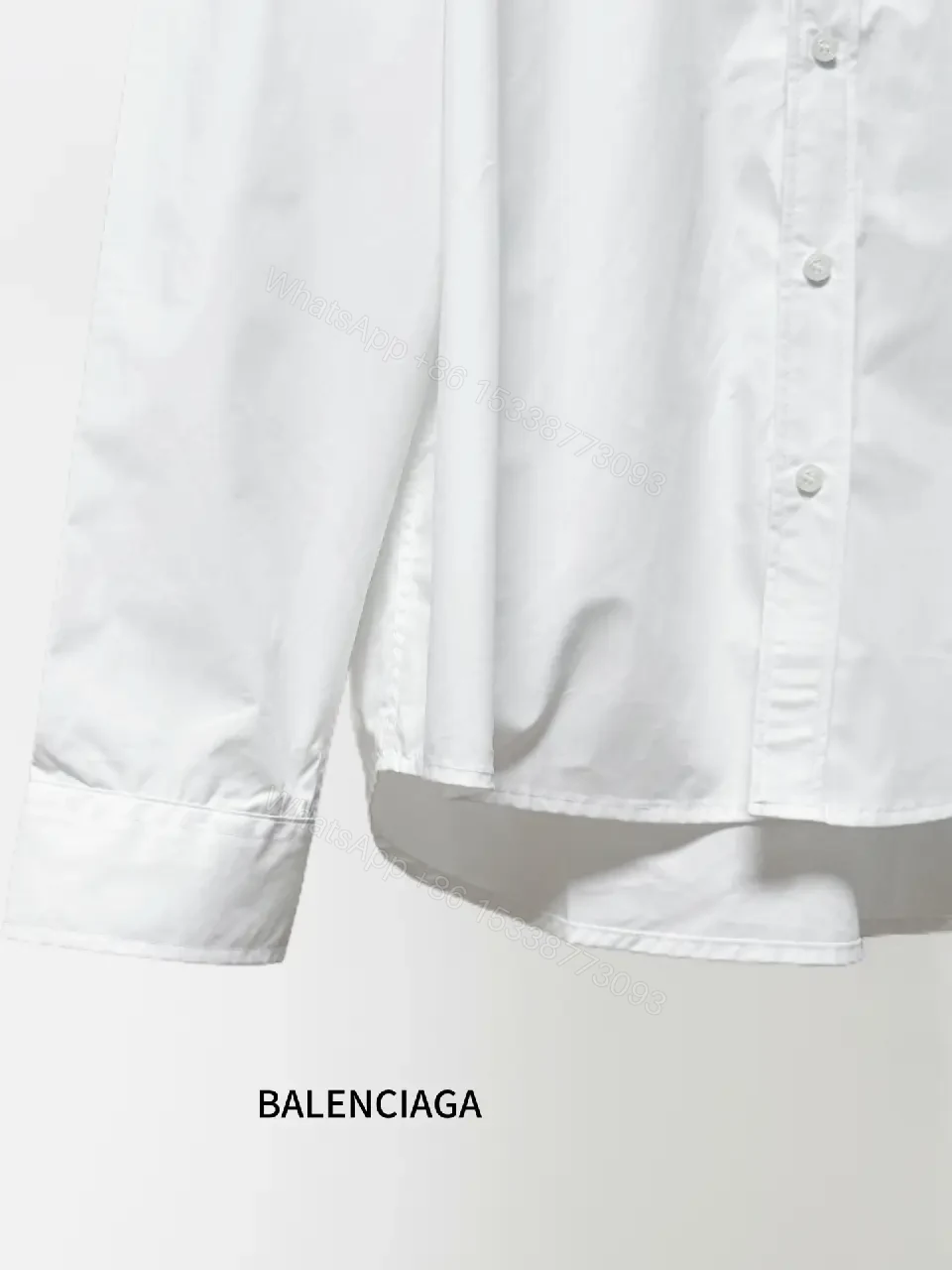 View 9 of Minimalist Button-Front Shirt with Subtle Logo Detail