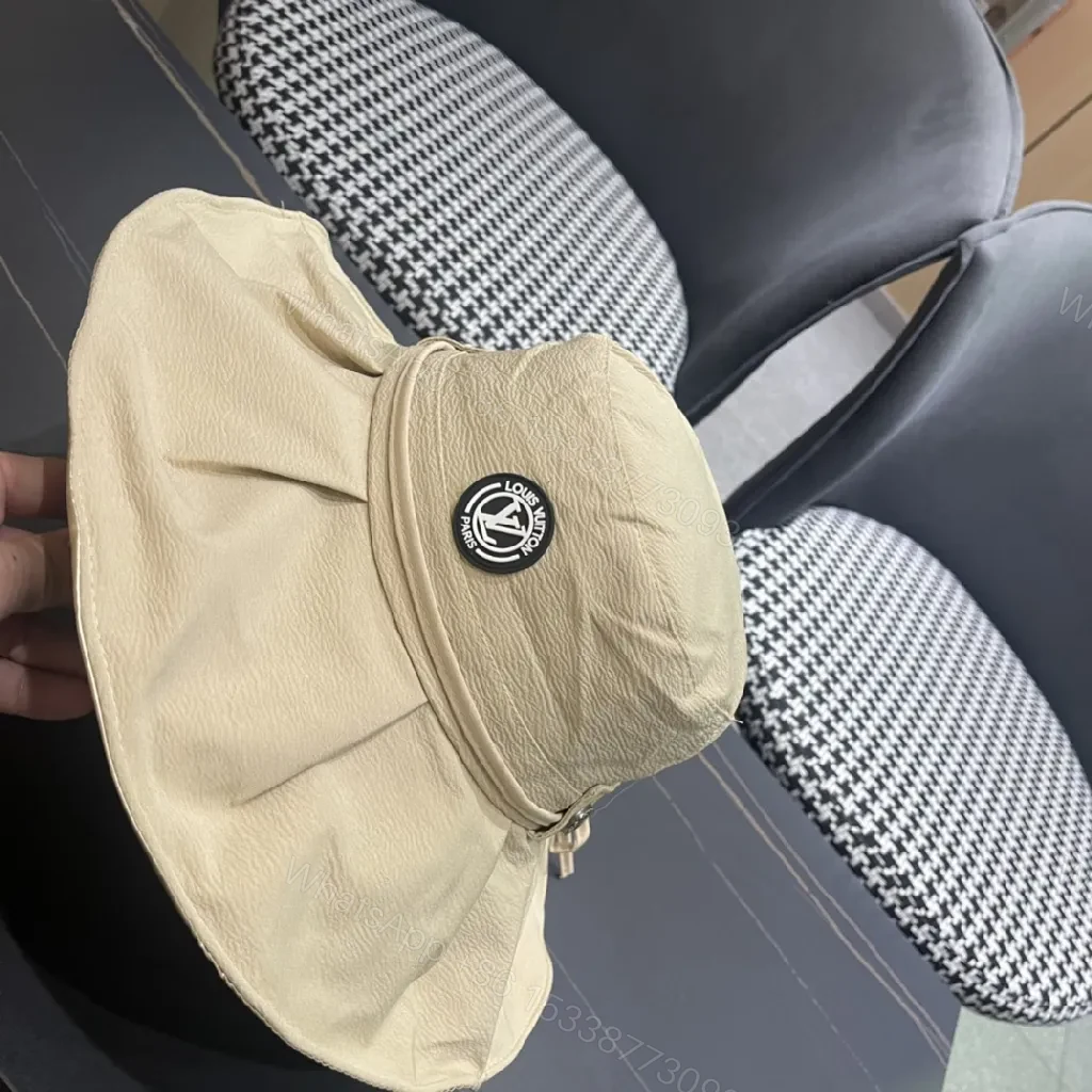 View 9 of Beige Textured Bucket Hat with Emblem, Everyday Luxury
