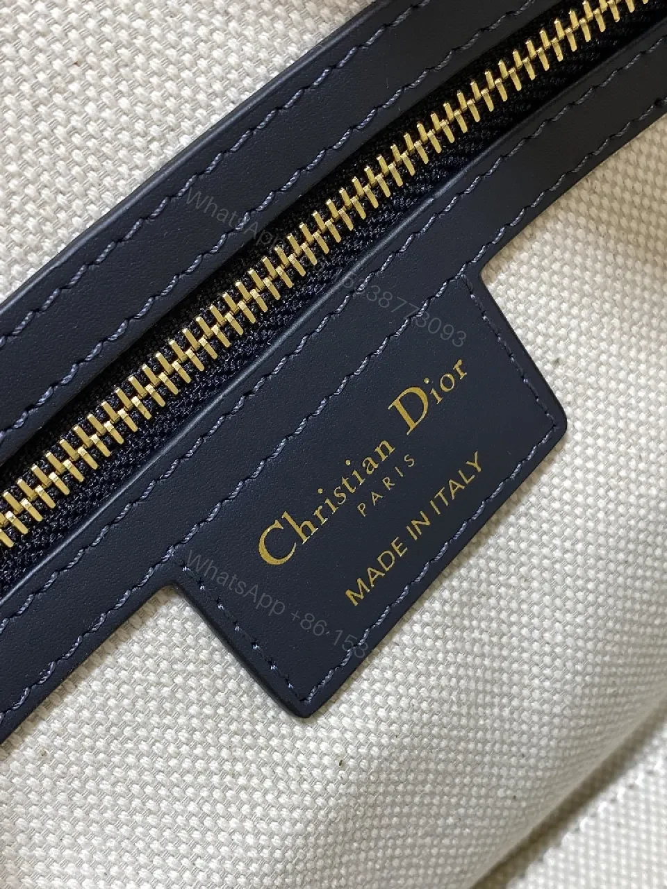 View 7 of Structured Luxe Navy Leather Mini Duffle Bag with Monogram Charm