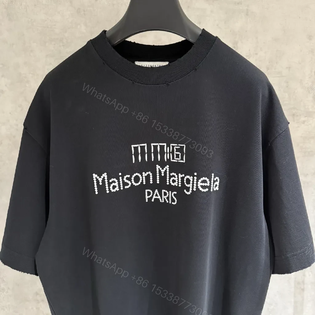 View 7 of Oversized Black Tee with Subtle Dot Logo — Luxe Everyday Wear
