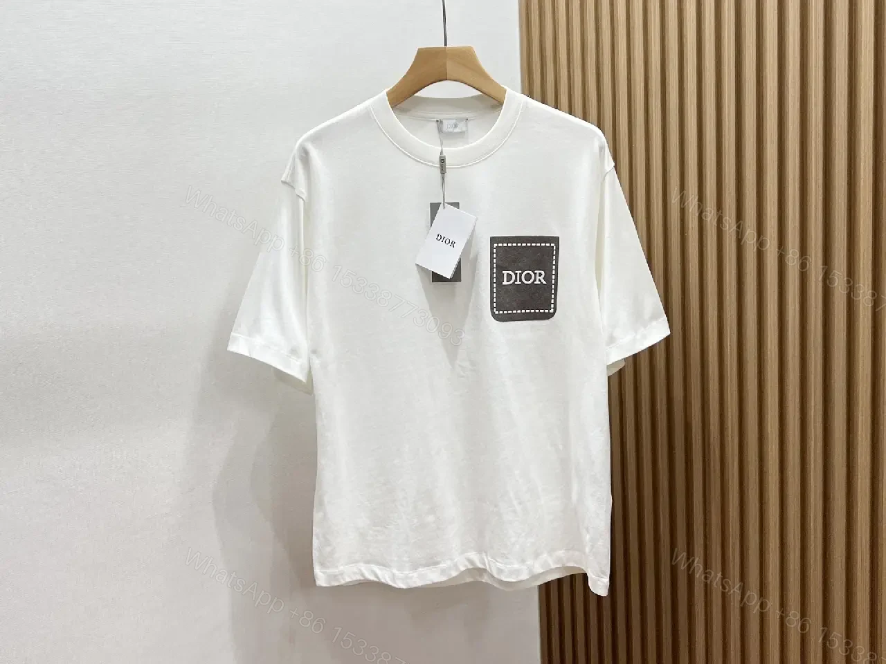 View 10 of Minimalist White Tee with Dior Pocket: Subtle Luxury T-Shirt
