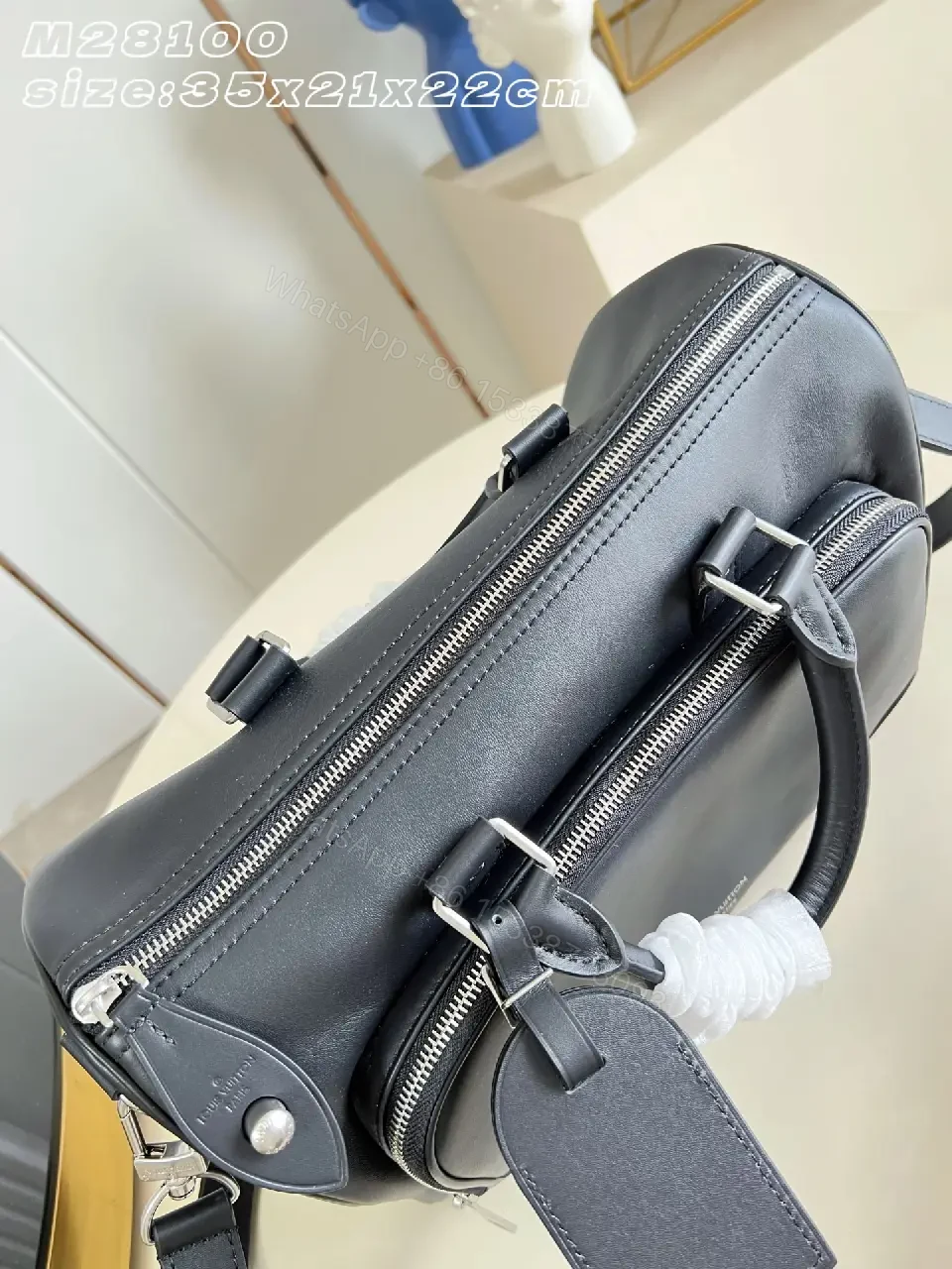 View 7 of Black leather structured satchel with top handle, removable strap, smooth finish, Louis Vuitton Paris (no brand details)