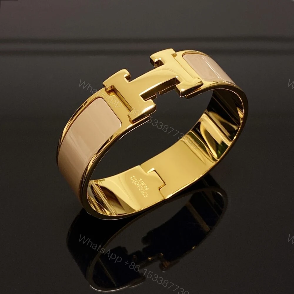 View 2 of Hermes Clic H Wide Bracelet Gold & Beige