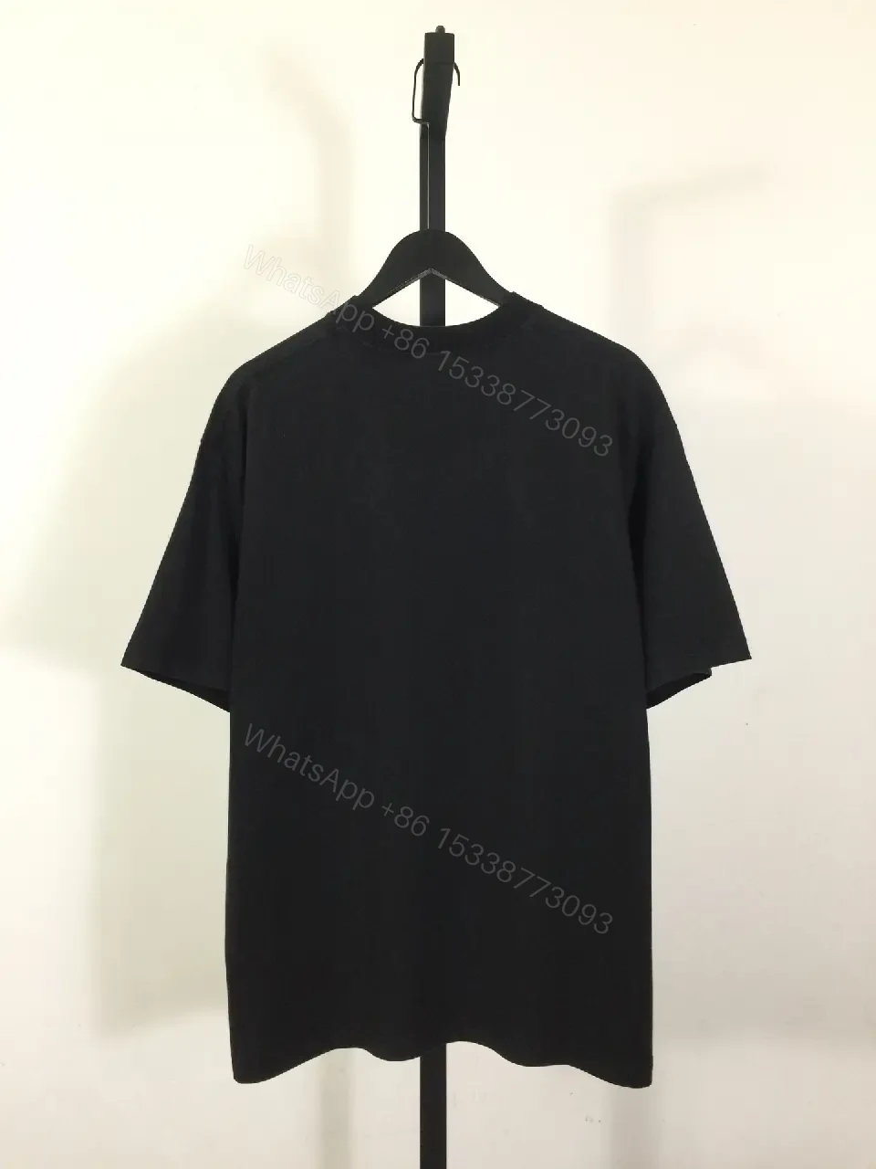 View 4 of Bold Graphic Tee with Distressed Logo: Luxe Streetwear Tee