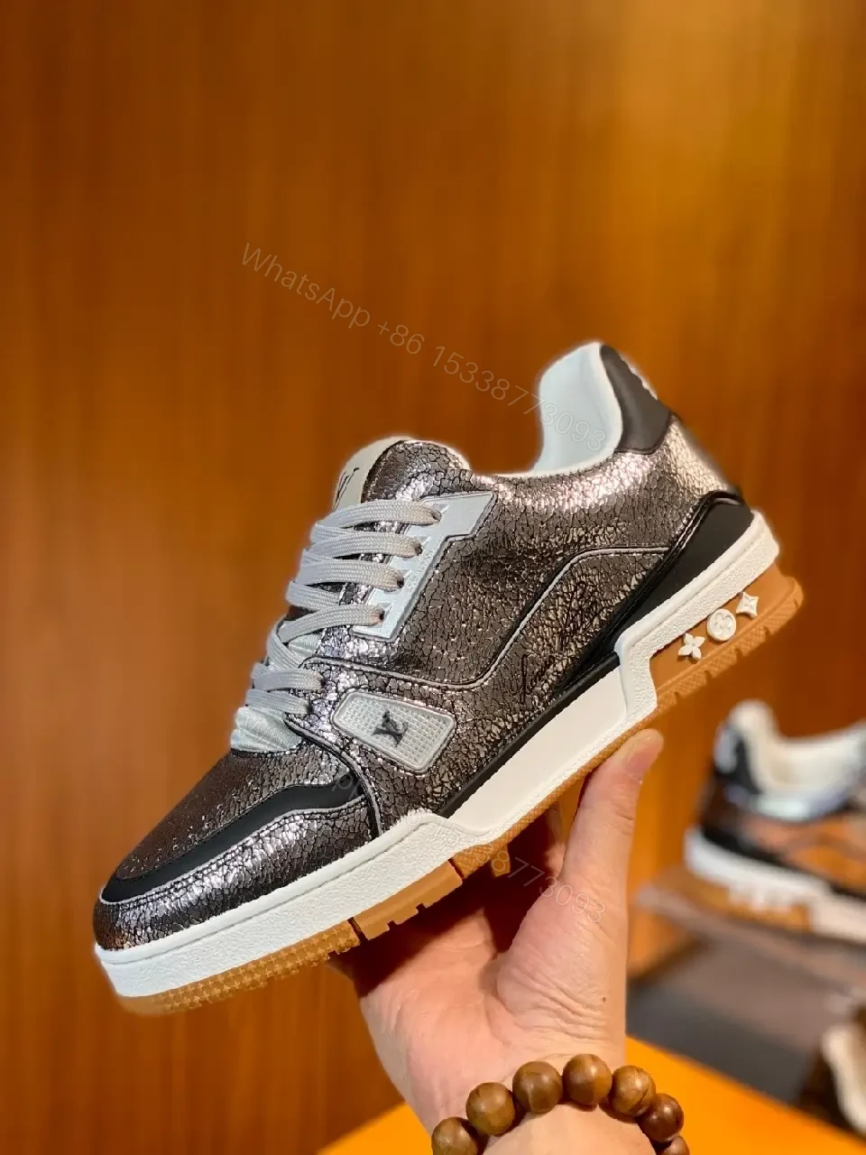 View 3 of Metallic Leather High-Top Sneakers with Subtle LV Detailing