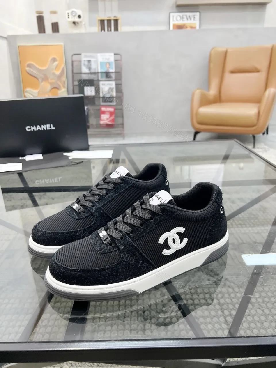 Black Knit Sneaker + Leather-Texture Overlay + Minimalist + Signature Logo + Sneaker — view 1