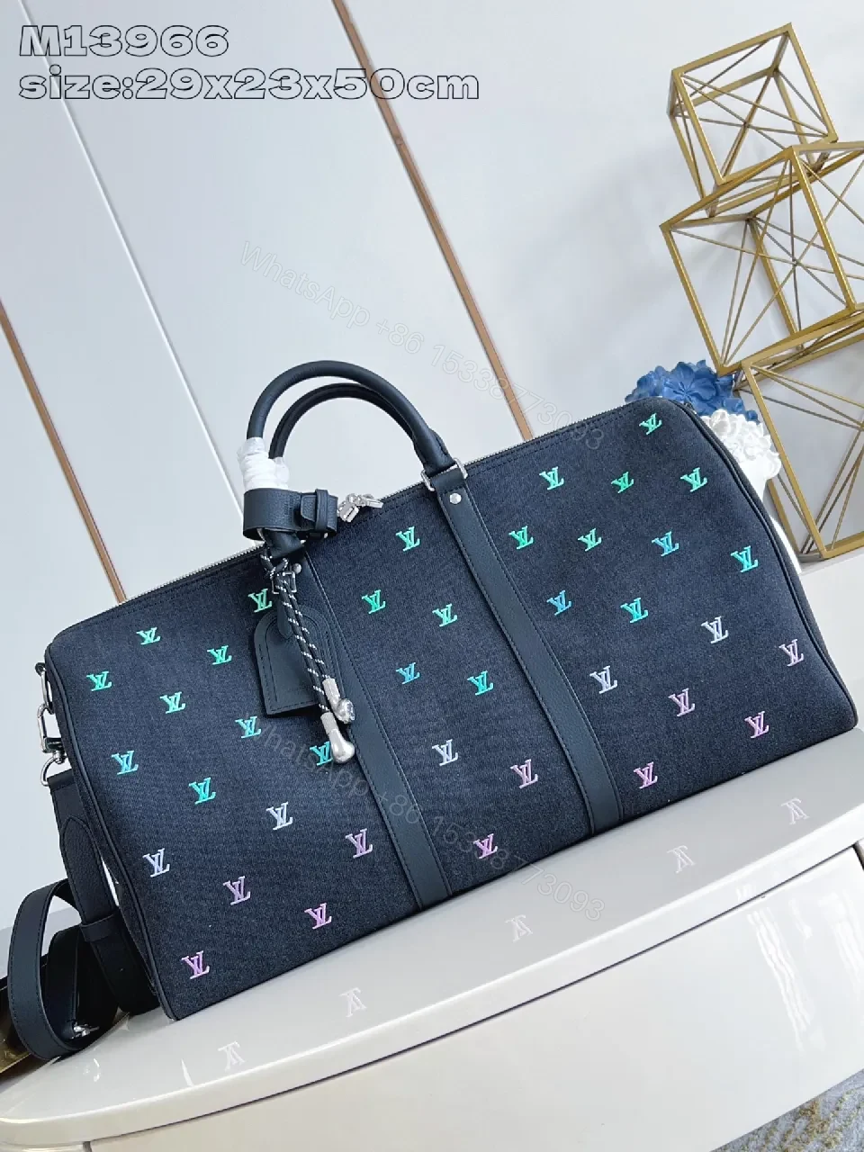 Bold Denim Travel Bag with Multicolor Monogram Details — view 1