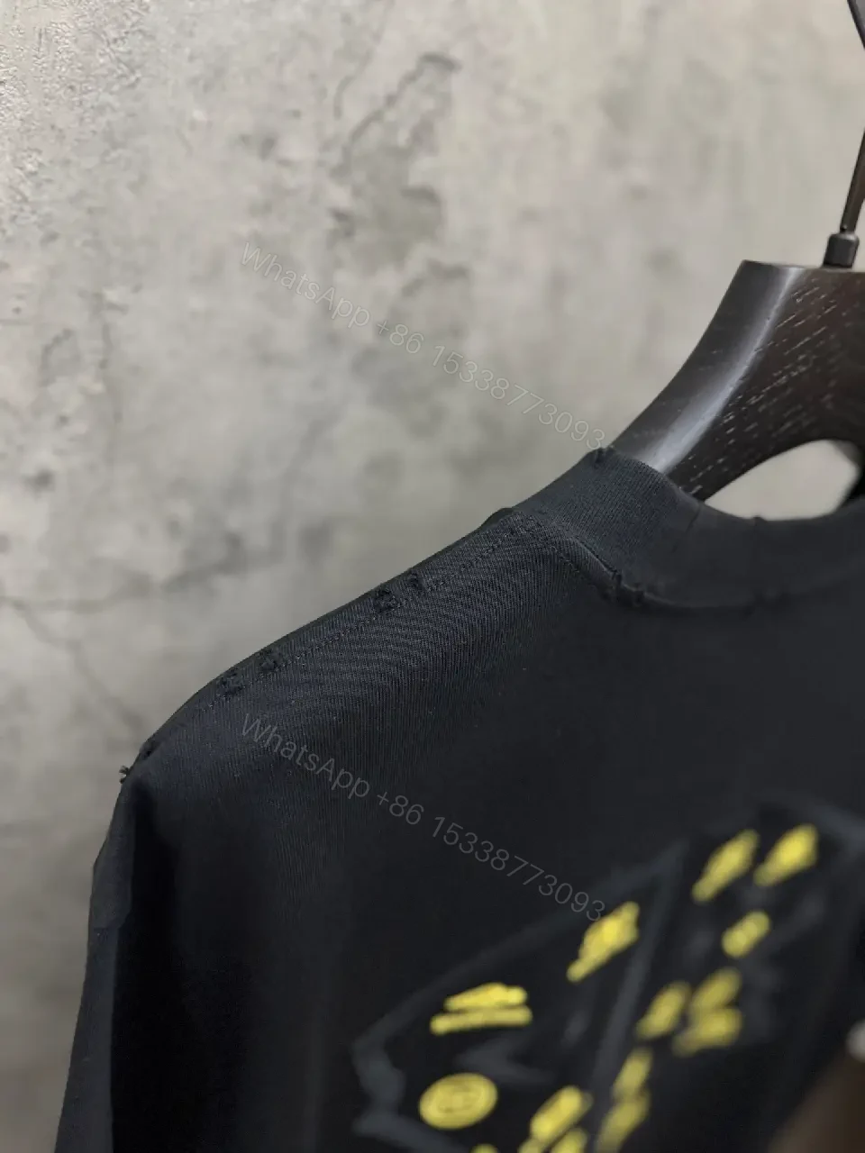 View 3 of Textured Logo Black Knit Tee – Oversized Luxury Streetwear