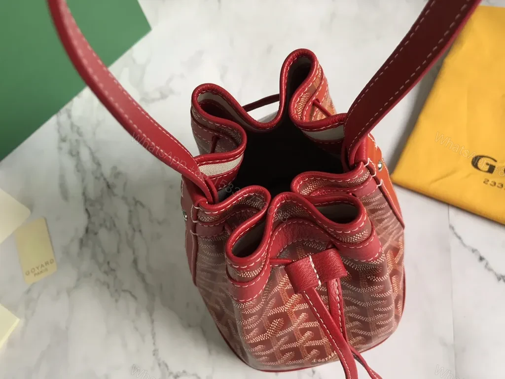 View 3 of Bold Goyardine Bucket Bag in Red Leather Trim