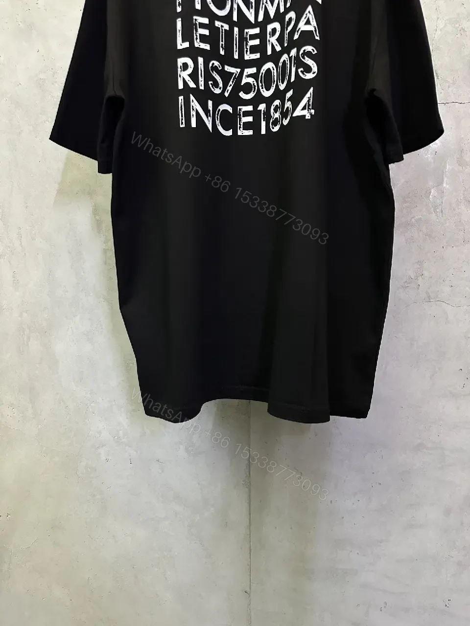 View 3 of Minimalist Black Tee with Subtle LV.M Emblem, Lux Cotton