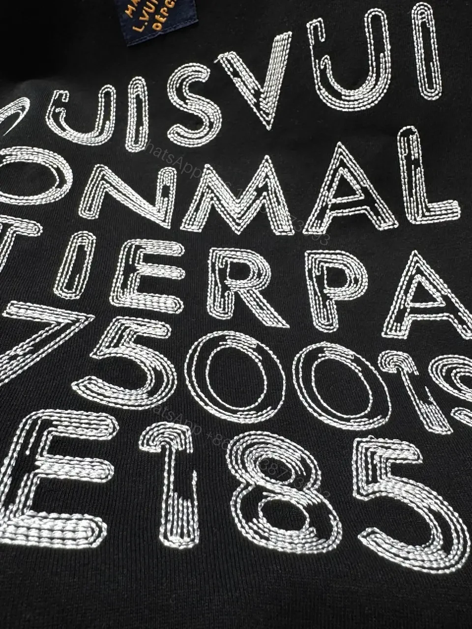 View 9 of Minimalist Black Cotton Tee with Subtle LV.M Logo