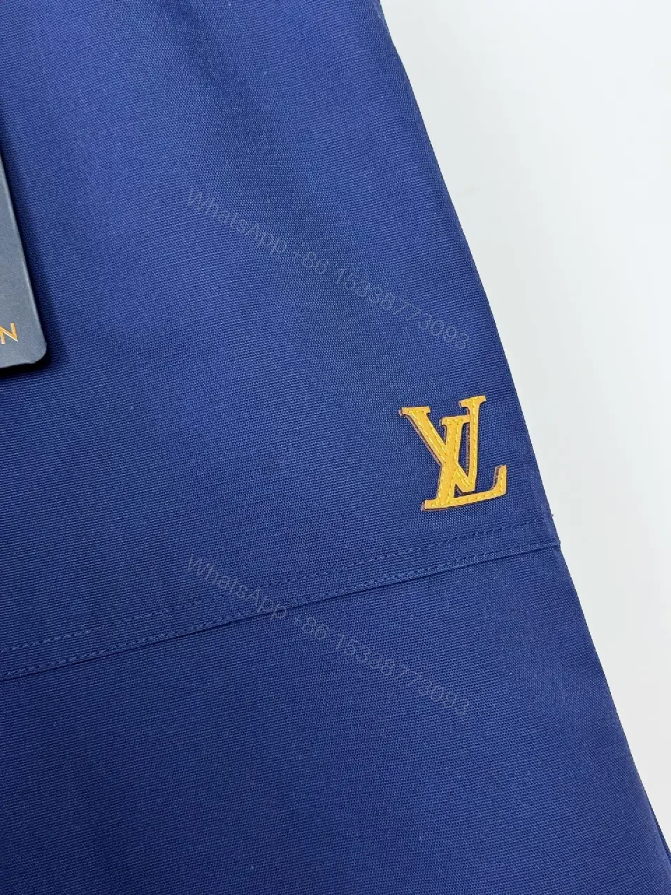 View 2 of Navy Linen Belted Bermuda Shorts Louis Vuitton Logo