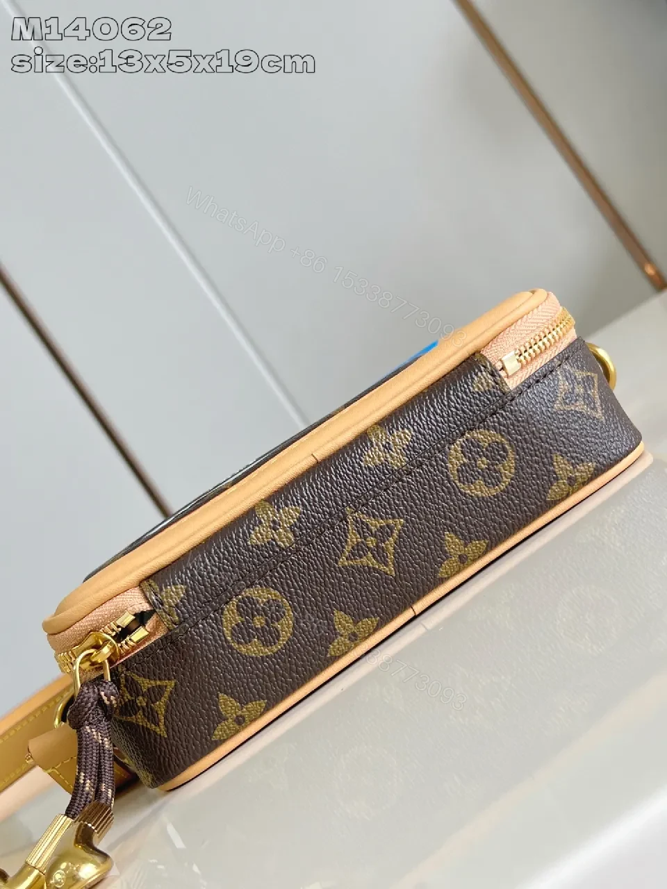 View 4 of Compact Luxury Crossbody: Monogram Canvas with Blue Accent and Gold Hardware