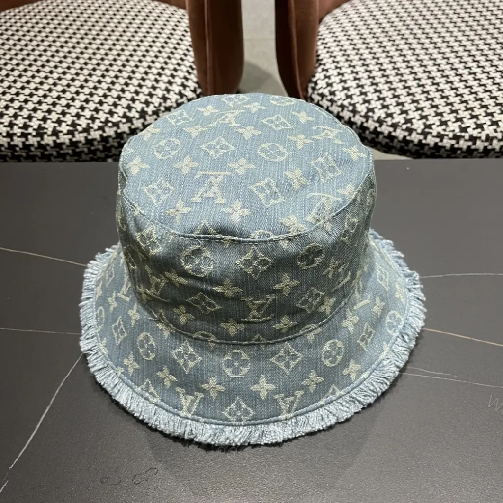 View 4 of Denim Bucket Hat with Monogram Detail – Casual Luxury & Comfort