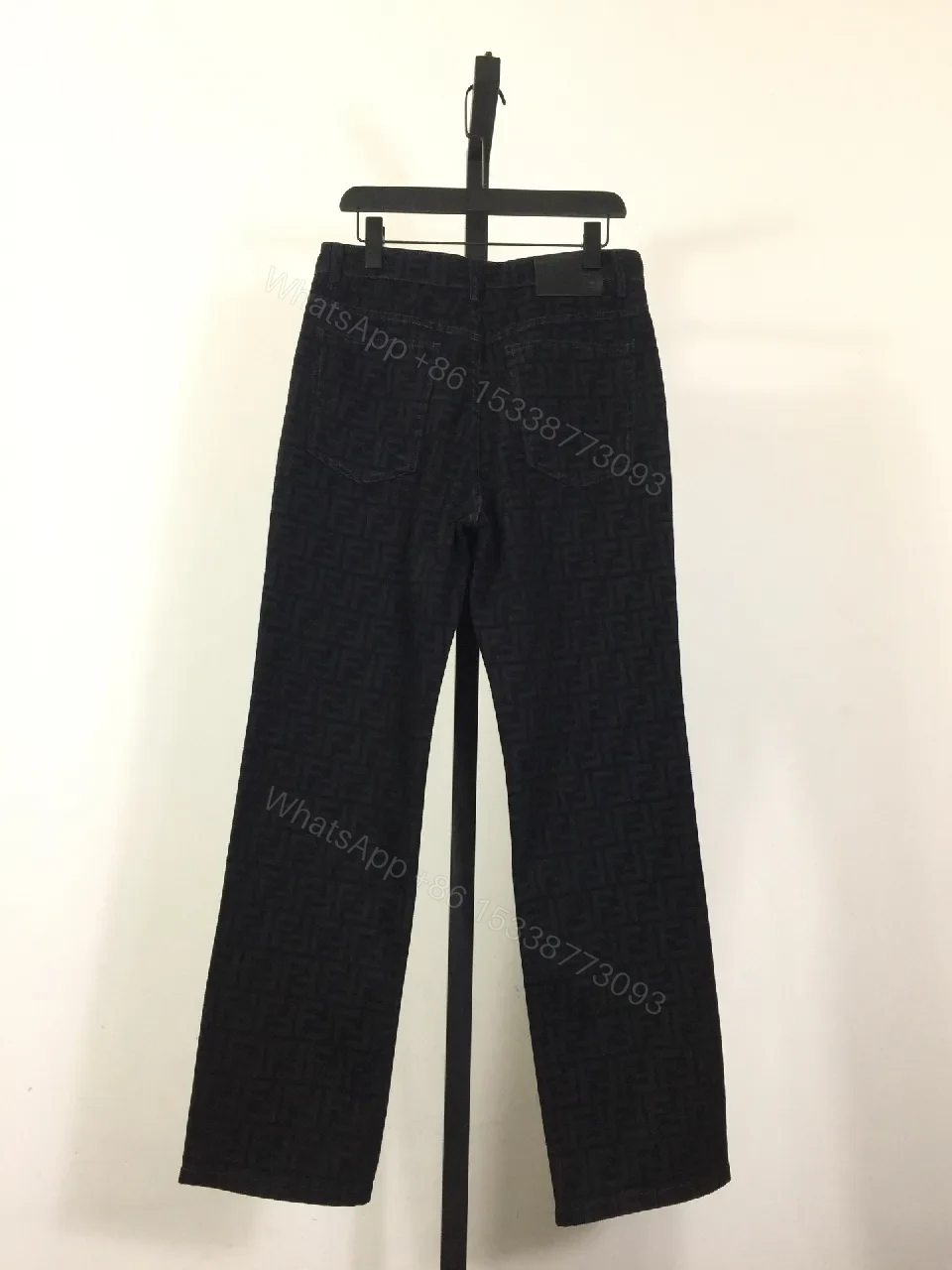 View 4 of Monogram Denim Trousers - Structured Texture, Modern Versatility