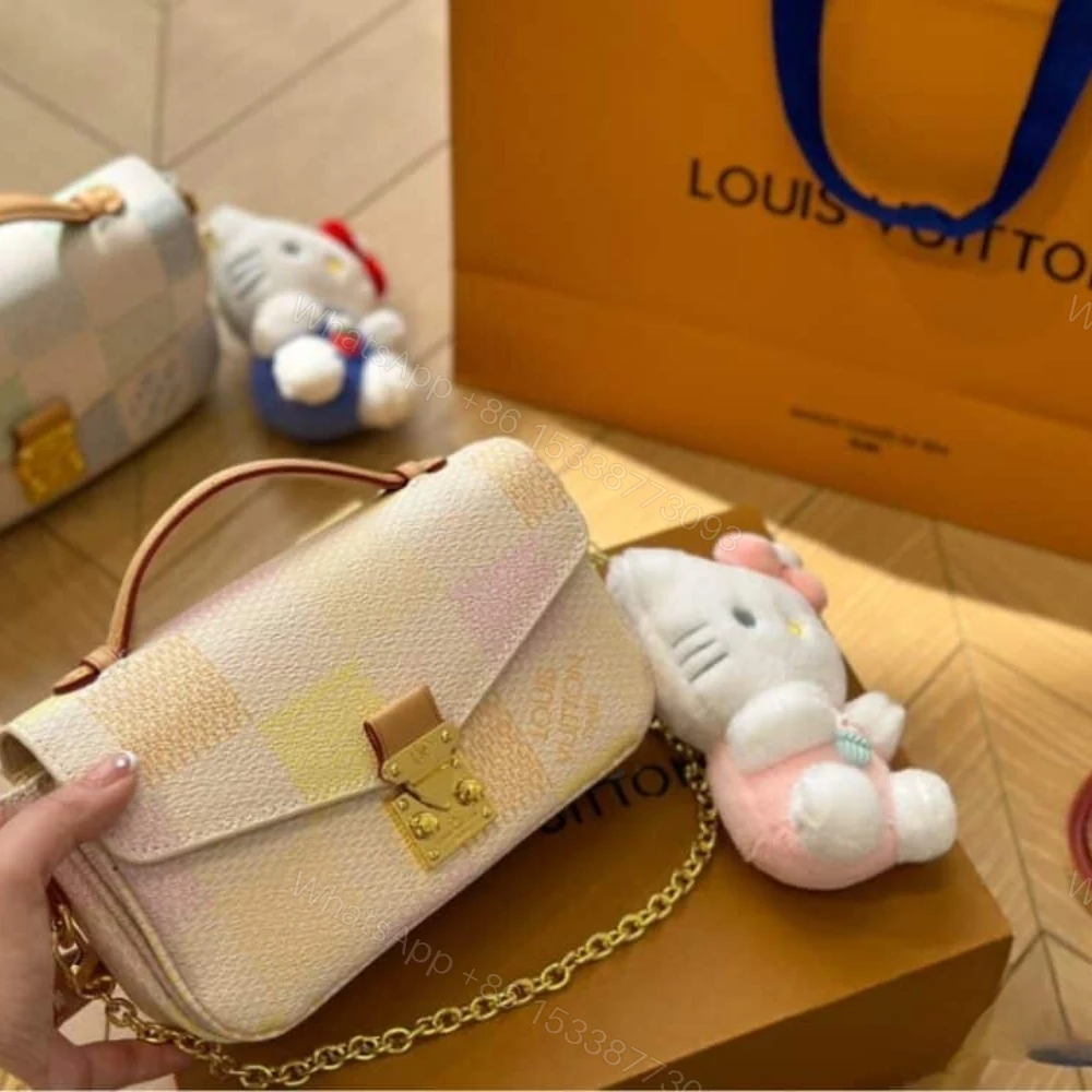 View 2 of Louis Vuitton Pochette Métis East West Damier Canvas Peach 21Cm N40749