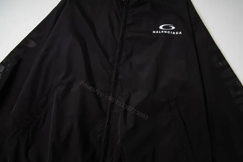 View 2 of Minimalist Black Windbreaker: Subtle Branding, All-Season Outerwear