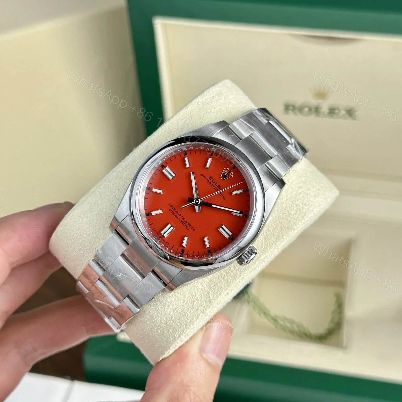 View 2 of Replica Rolex Oyster Perpetual Coral Red Dial 124300 41 mm