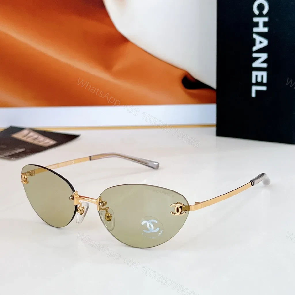 View 8 of Rimless Blue Lens Sunglasses with Gold-Tone Frames