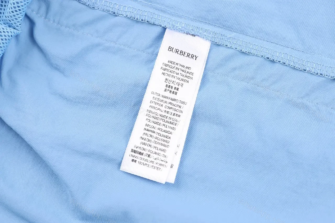 View 2 of Light Blue Cotton-Blend Swim Shorts with Burberry-Check Side Strips