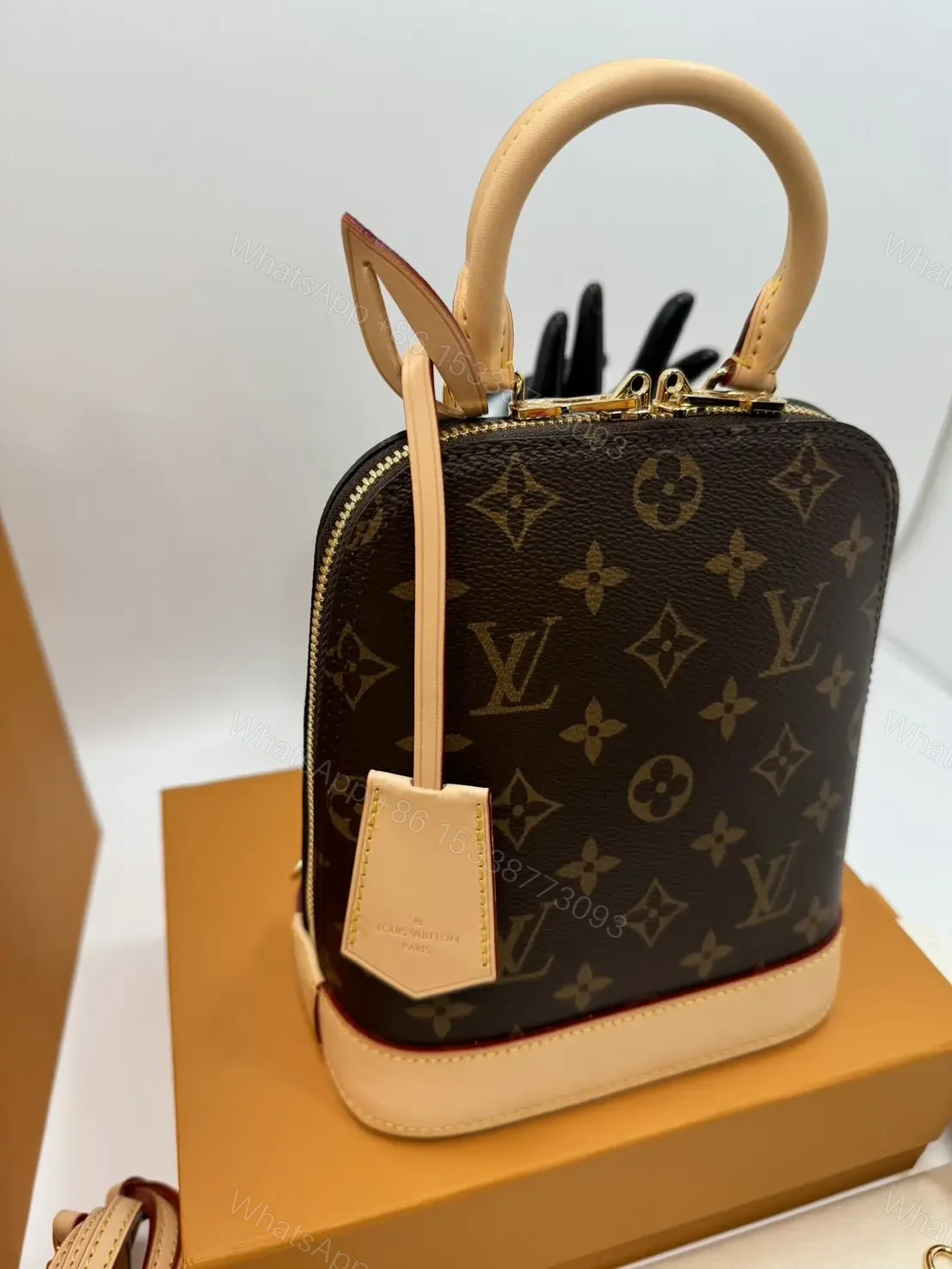 View 6 of Louis Vuitton Alma backpack in the signature brown monogram canvas