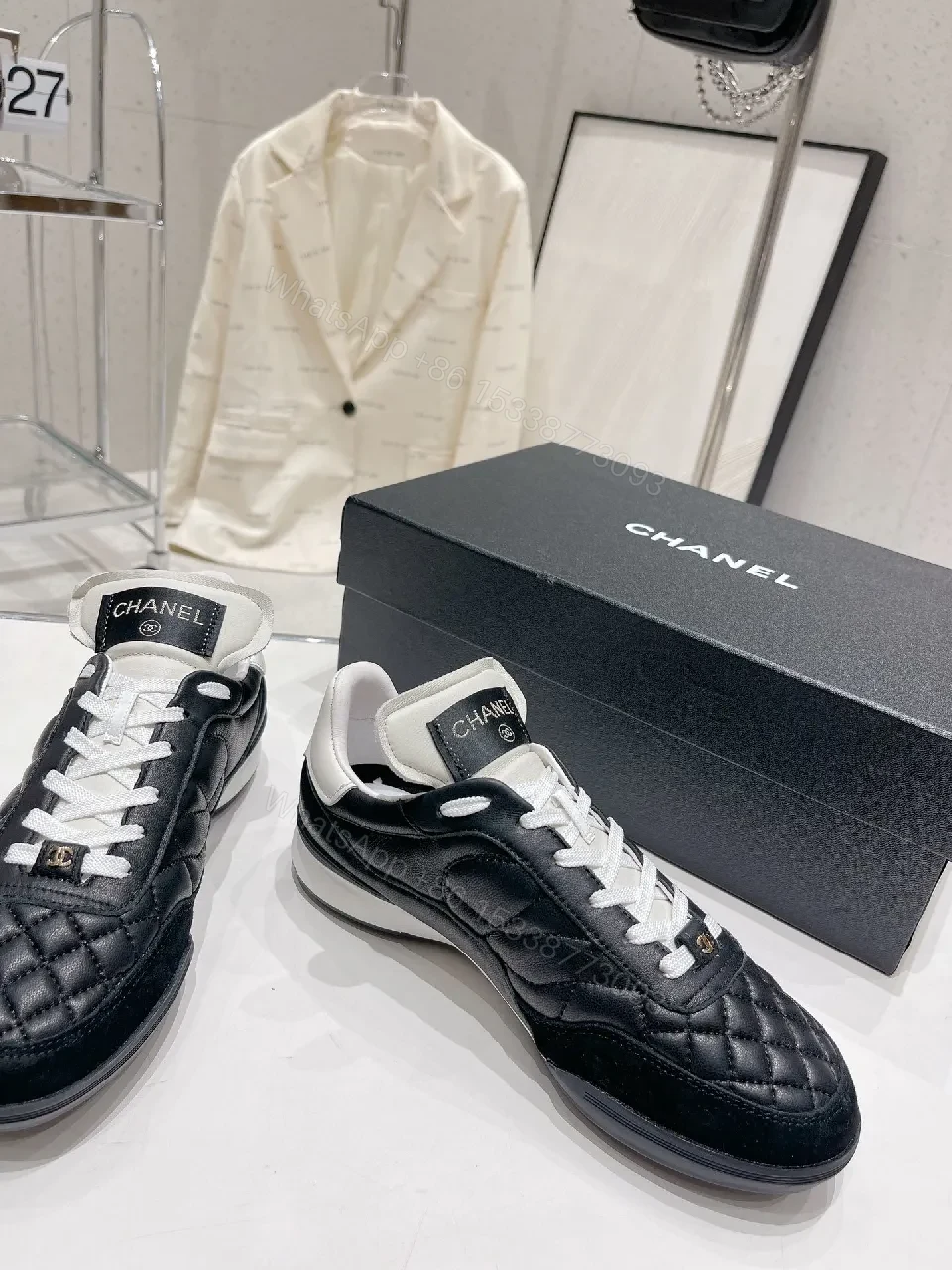 View 9 of Quilted Black Leather Sneakers with Luxe Branding Detail