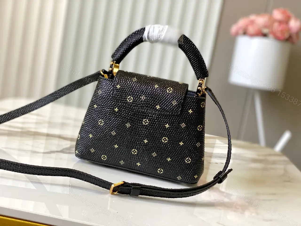 View 3 of Compact Black Pebble-Grain Top-Handle Bag with Gold Hardware