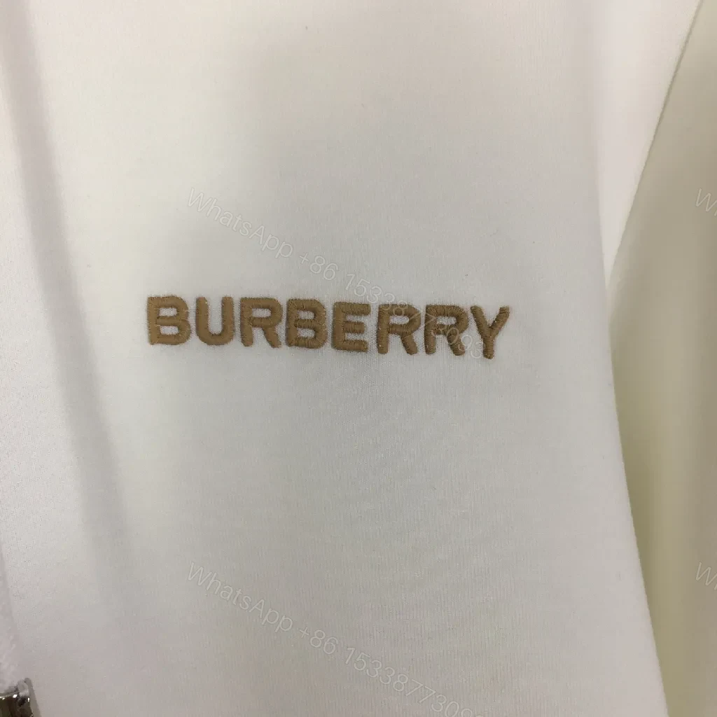 View 6 of Minimalist Off-White Hoodie with Subtle Logo Design