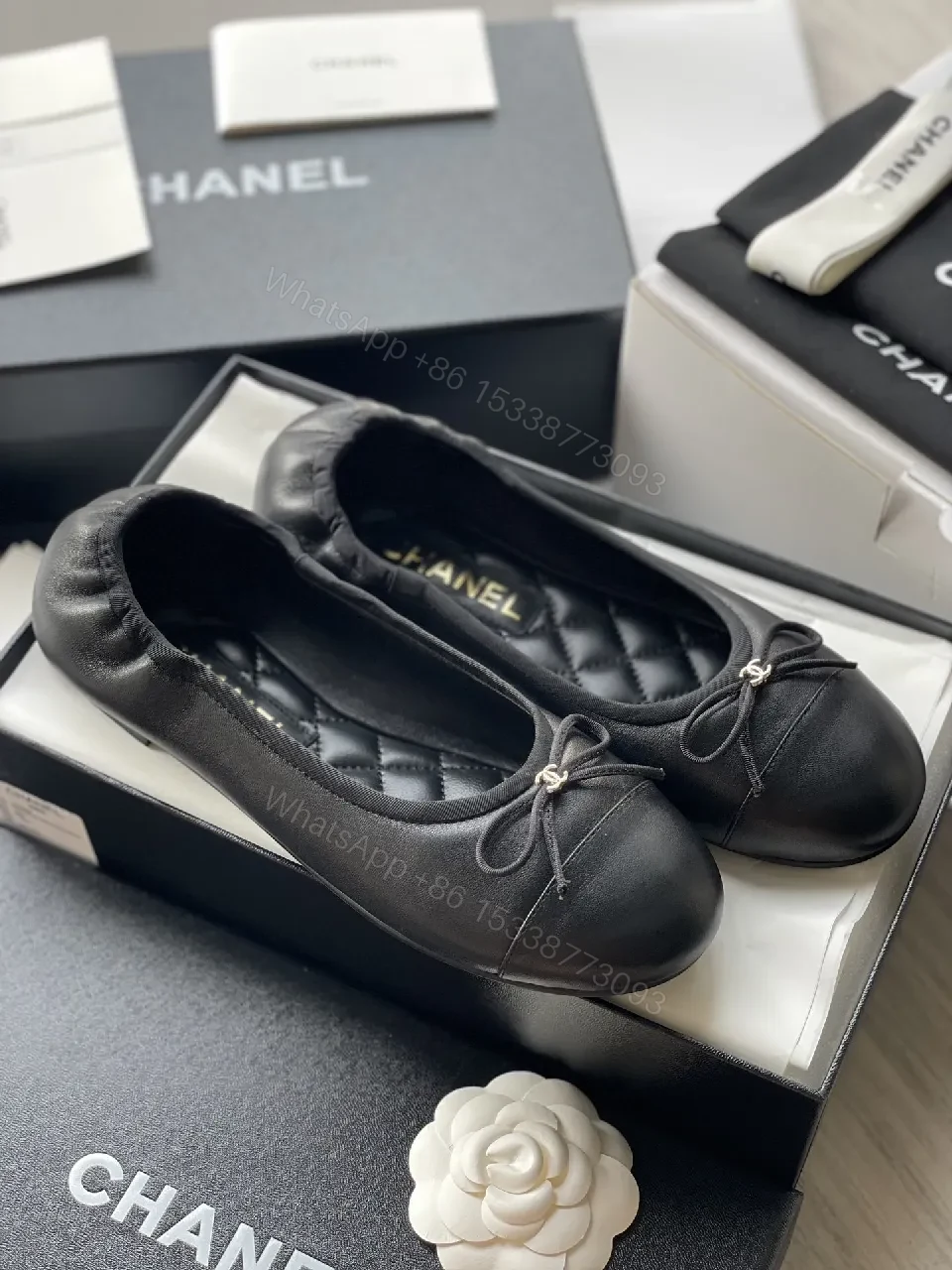 View 7 of Quilted Black Flats with Gold Logo Accents - Chic Comfort