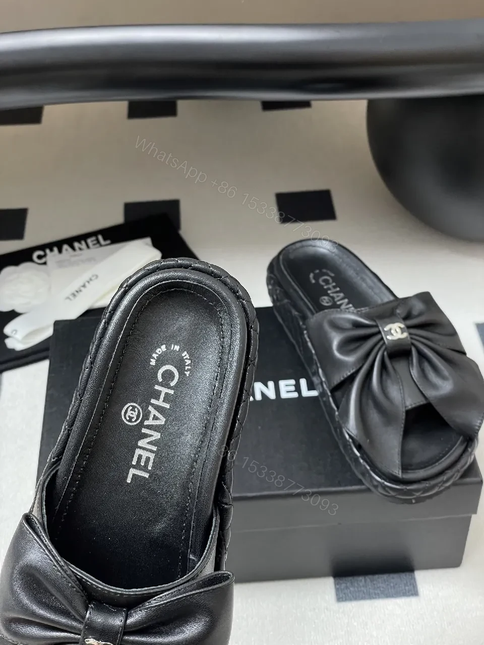 View 6 of Chic Black Quilted Slides with Bow Detail - Luxury Casual Platform