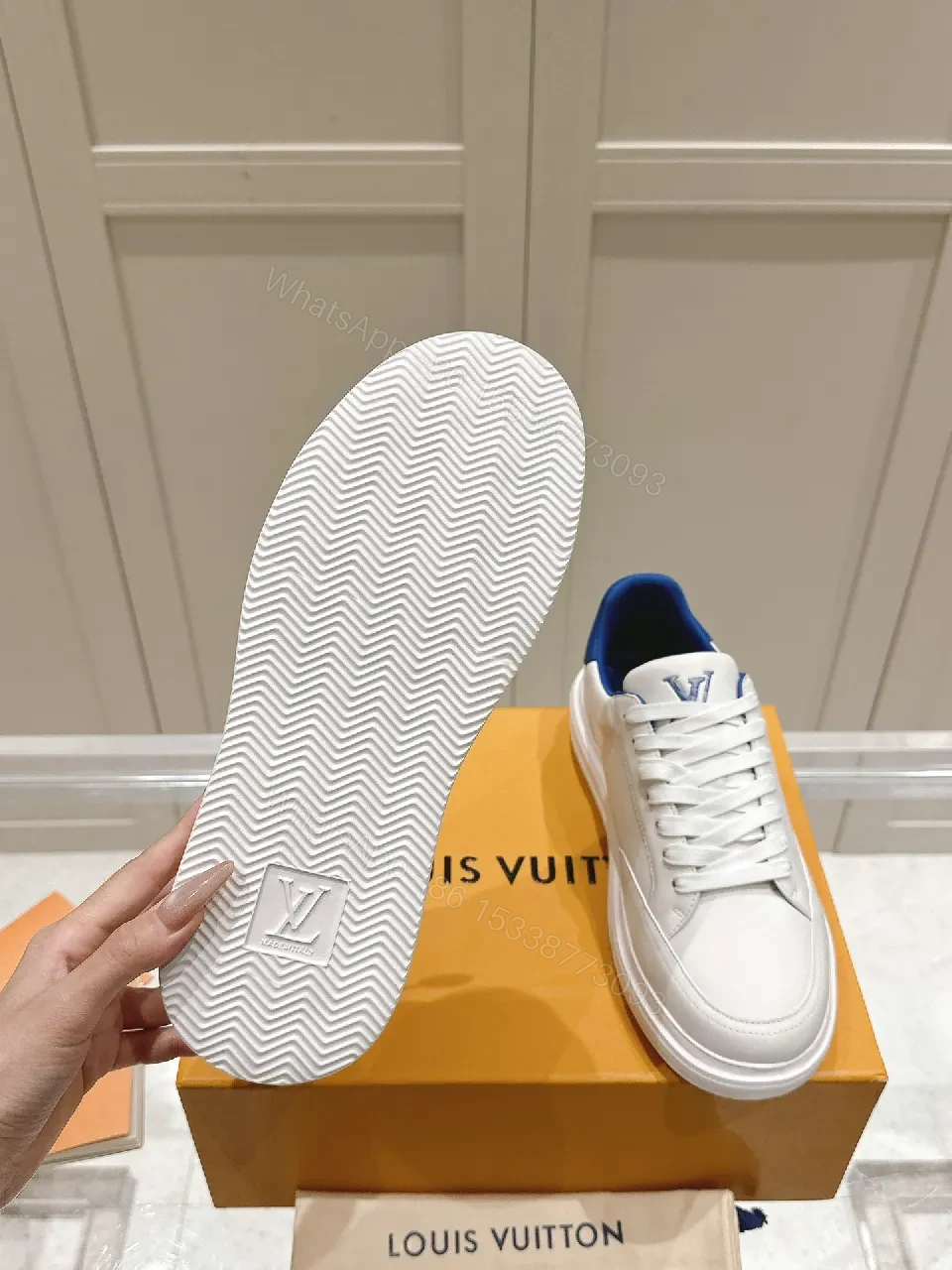 View 3 of Clean White Leather Low-Top Sneakers with Subtle Designer Embellishments