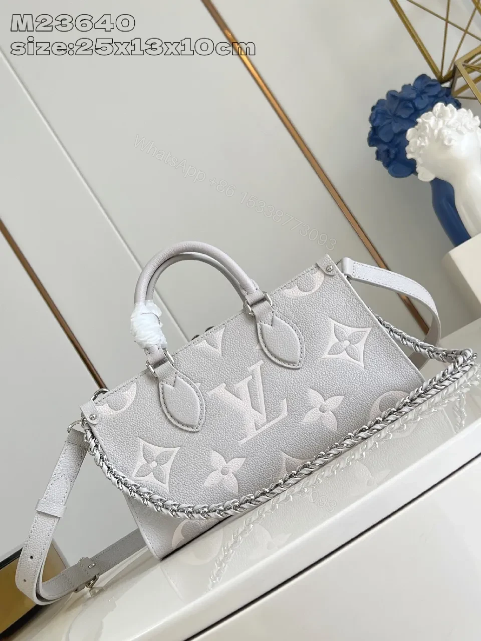 View 2 of Monogram Embossed Leather Tote: Structured Luxury Bag