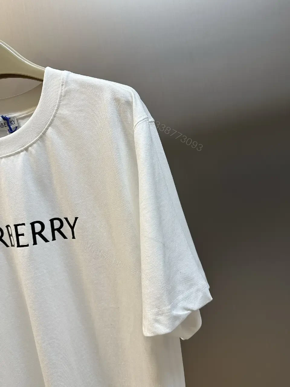 View 4 of Minimalist Burberry-Style White Cotton Tee: Elevated Everyday Comfort