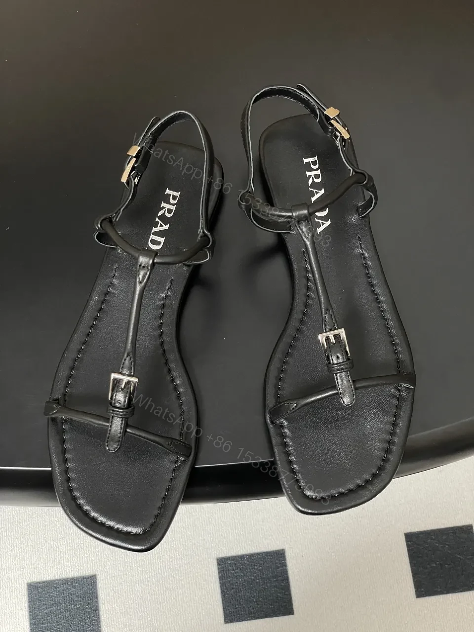 View 4 of Minimal Black Leather T-Strap Sandals with Padded Comfort