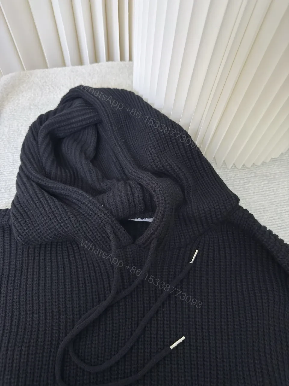 View 3 of Chunky Knit Hoodie in Deep Black with Subtle Logo Embossing, Modern Luxe