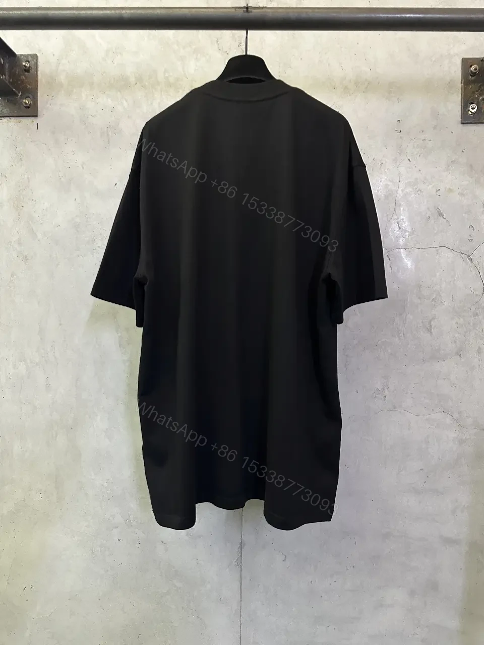 View 3 of Oversized Black Logo Cotton Tee – Modern Streetwear Essential
