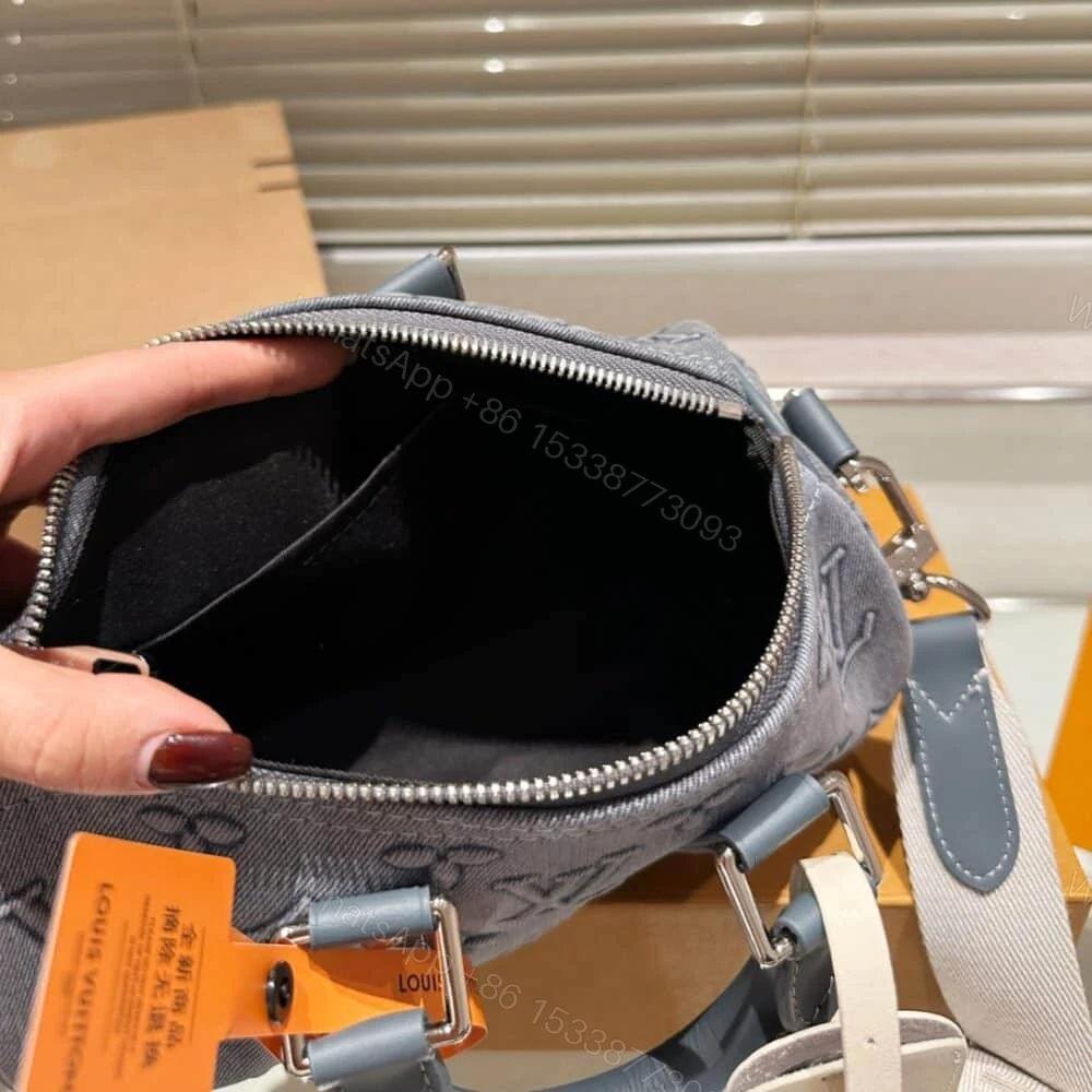 View 7 of Louis Vuitton Keepall Bandoulière 25 Monogram Washed Denim Canvas 24Cm M22762