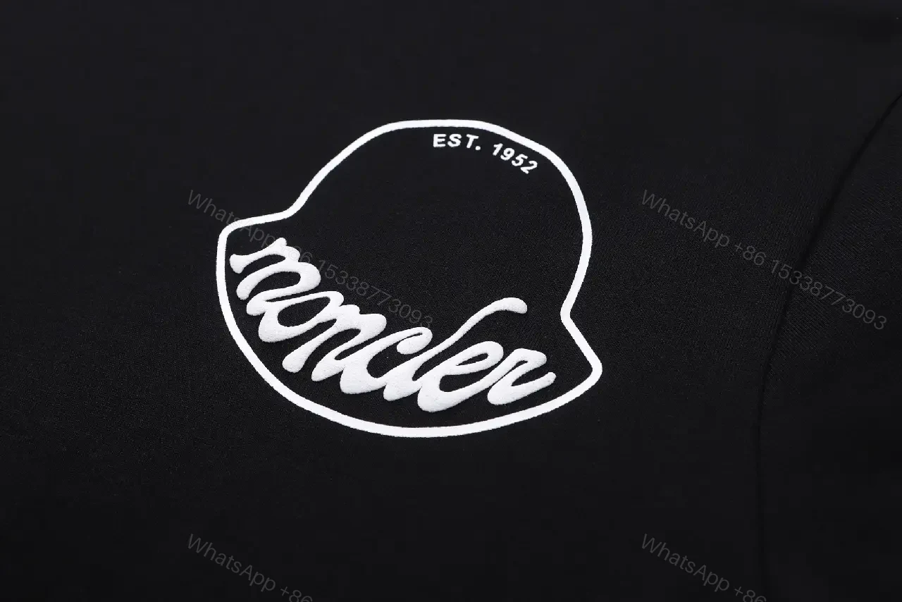 View 2 of Black Cotton Tee with Crest – Subtle Luxe Streetwear Top