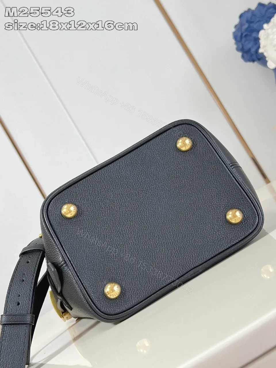 View 4 of Polished Grain Leather Bucket Bag with Gold Hardware, Minimalist Style, Everyday Carry