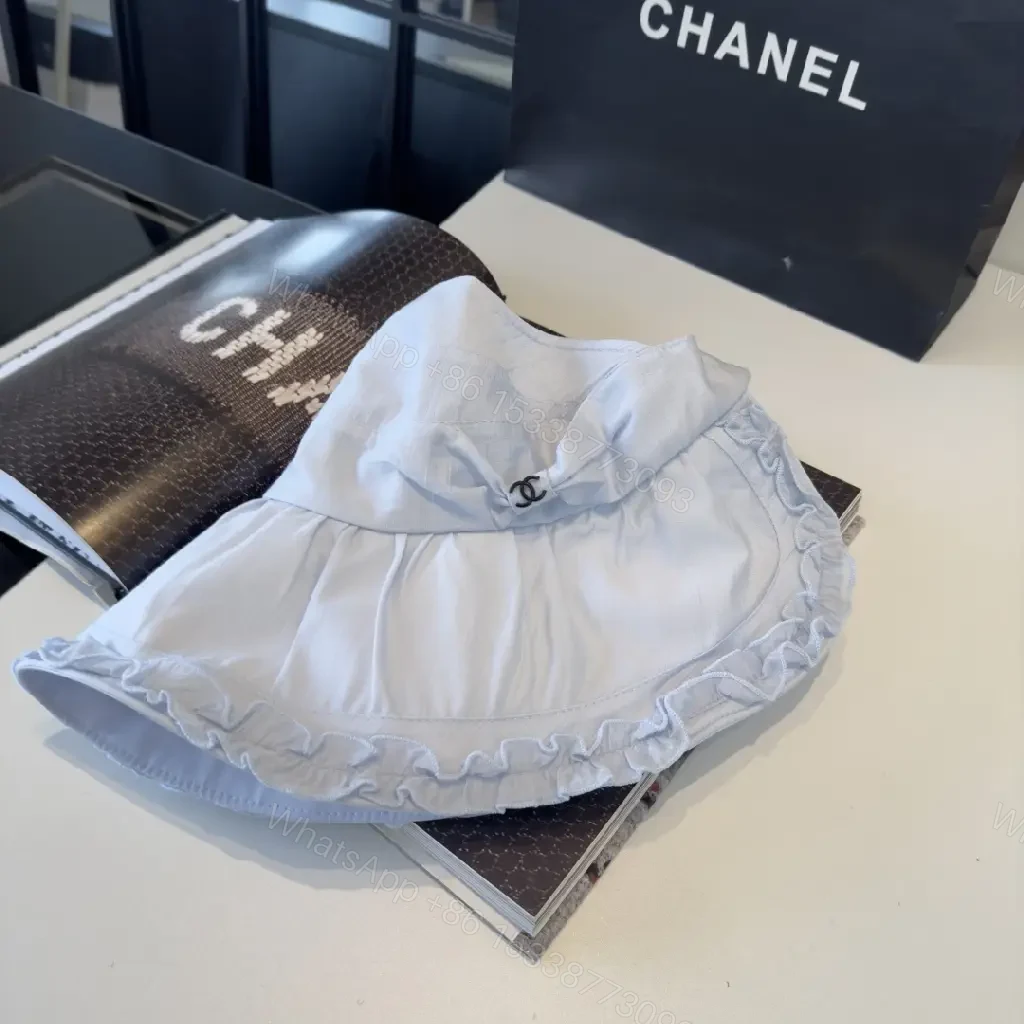 View 9 of Pastel Blue Floppy Hat with Ruffled Brim & Chanel Charm